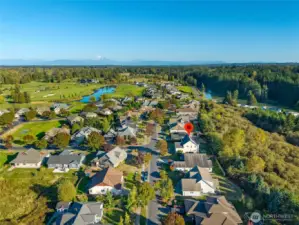 This stunning home is adjacent to the Loomis Trail Golf Course and enjoys privacy and security in this gated community.