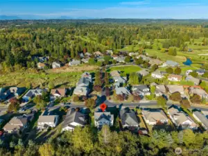 This house is located in The Greens at Loomis Trail, a gorgeous neighborhood adjacent to Loomis Trails Golf Course.