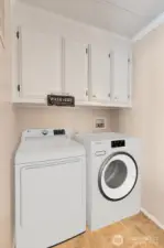 Utility room has cabinet storage above washer, dryer area for all your laundry necessities. Access door to the private, fenced back yard.