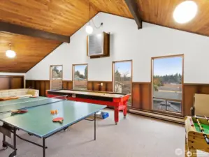 Upper level has game room with ping pong table., põhus ball table and more.