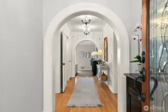 The main floor welcomes you with an elegant entry, flowing into a stunning kitchen featuring custom cabinetry, stainless steel appliances, quartz countertops, and a charming built-in bench seating dining nook.