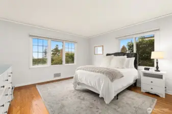 Two bedrooms on the main level include one with an ensuite, plus an additional ¾ bath.