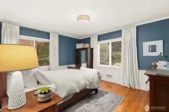 Two bedrooms on the main level include one with an ensuite, plus an additional ¾ bath.