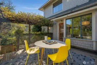 Kitchen door leads to private back deck with stairs leading to gardens  below