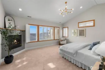 Primary bedroom with panoramic views, fireplace, en suite bath and soaking tub