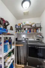 Utility room adjacent to entrance of three car garage