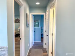 Hallway to rooms, laundry, bathroom