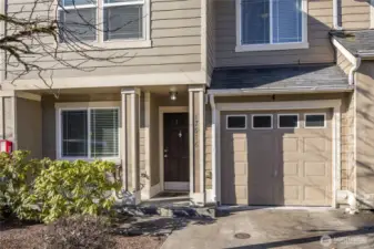 Covered front porch, attached 1-car garage and driveway parking for a second vehicle