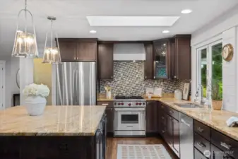 Yes, that's a wolf range! Refrigerator and dishwasher are newer!