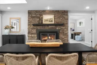 Stacked stone fireplace in the dining space is gorgeous! Two fireplaces in the living spaces provide ambiance and a warmth.