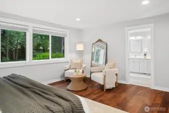Backyard views from the primary suite add privacy and a sense of calm.