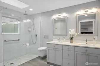 The primary bath is a showstopper! Tranquil colors, modern elements, this space is a wow! Dual vanities, beautiful quartz countertops, sophisticated and lighting!