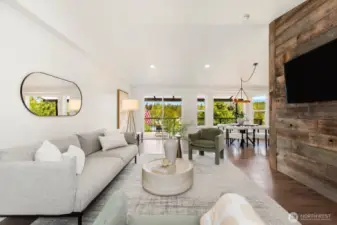 Natural light floods the open concept living and dining space, while large sliders offer seamless indoor-outdoor living. It’s the heart of the home—with a view!
