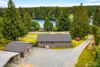 Your Lake Life Awaits  Just across the road from tranquil lake views and minutes from the boat launch, this home is perfectly placed to enjoy water adventures and peaceful forest living all in one.
