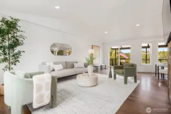Soaring ceilings and fresh, modern finishes create a bright and airy living space. The open floor plan flows effortlessly to the covered deck, bringing nature right into your living room.