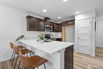 Photographs are for illustrative purposes only. Features, finishes, interior/exterior colors, landscaping and floorplan shown may vary from actual homes built.