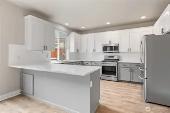 Beautiful refreshed kitchen with new quartz counters, new subway tiles and stainless appliances~