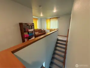 Head upstairs to alcove space...great study area, crafts, computer/office space.