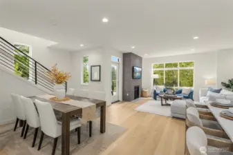 Conversation flows effortlessly in this stylish open-concept space—designed for everyday moments and unforgettable gatherings. (photos of model home)