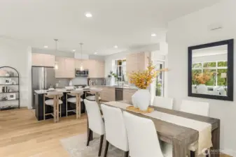 Formal dining space that easily accommodates large gatherings with easy access to kitchen and living areas. (photos of model home)
