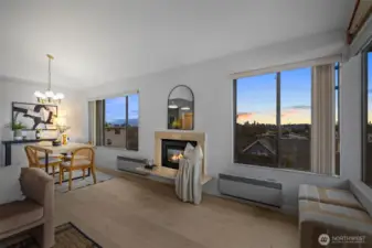 Stunning sunset views of the Seattle skyline, Space Needle, and mountains in this Southwest facing condo.
