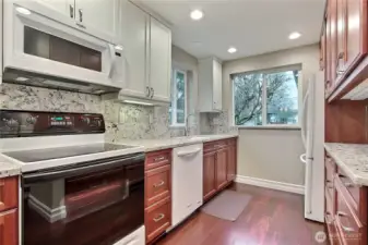 Updated kitchen with granite counter tops.