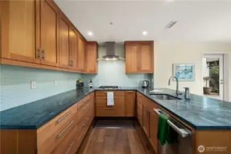 Completly remodeled kitchen with Cherry cabinets, solid stone counter and top appliances.