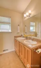 The primary bath is spacious with double vanities....