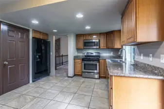 Kitchen features stainless steel appliances and granite counters