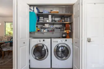 All appliances stay, including the washer and dryer. There's a hanging rack and storage here. Everything you need and want. Door to attached, DOUBLE garage on the right.