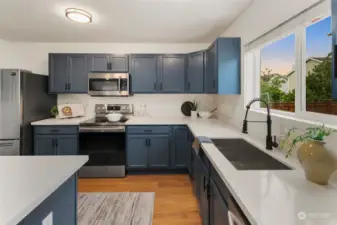 Kitchen has an abundance of counter & cabinet space