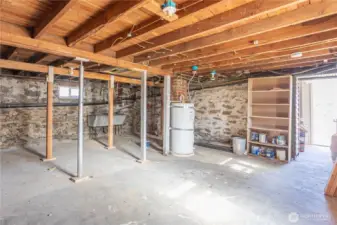 Unfinished side of basement - nice and dry, great storage or workshop space