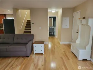 Living room showing stairs to 2nd floor