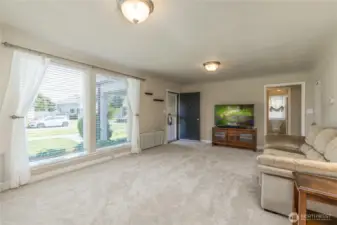 Living room has huge windows for great natural light