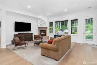 This spacious living area looks out to the beautiful natural setting. Brand new Levelor Up-Down window coverings give you privacy plus light, just as you wish.