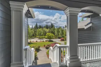 The covered front porch deck looks out directly at the community park in Olympic Terrace 1.