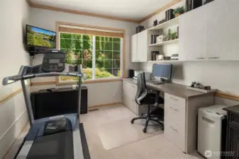 Enjoy the idyllic views to the tranquil backyard while working from home in your main floor office. Built in cabinets and desk are perfect for extra storage space.