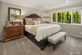 Primary bedroom is so spacious and calming. Warm, muted colors bring a sense of calm to your own sanctuary.