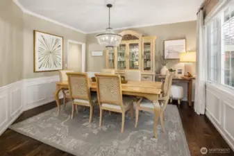 Formal dining room is large and perfect for entertaining. Wainscotting that surrounds the room completes the sense of elegance.