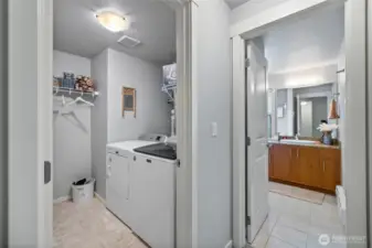 Laundry room & bath conveniently located next to one another.