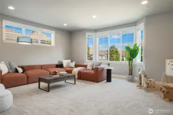 Generous sized Rec/ Media/ Game room with bay window.