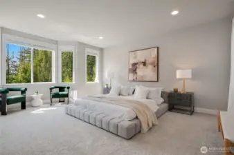 Primary suite with sitting space and bay window.
