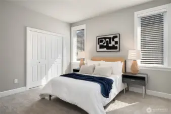 Another spacious and sun-filled bedroom on the upper level.