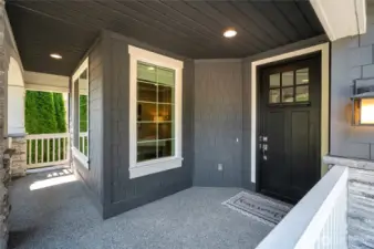 Inviting, spacious covered porch for morning coffee or reading.
