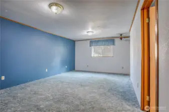 primary bedroom w office space in basement
