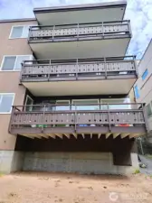 The rear of the building showing large balconies for each unit - one unit per floor.