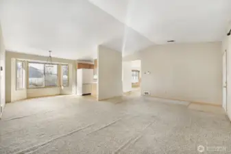 The open concept floorplan.  You can see the dining area, kitchen and family room.