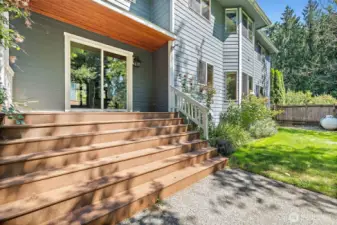 Stately steps to backyard with small deck off the dining room
