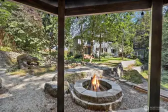 Gazebo with patio and firepit next to the koi pond for relaxation