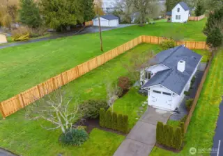 Spacious, level lot with brand new fencing.
